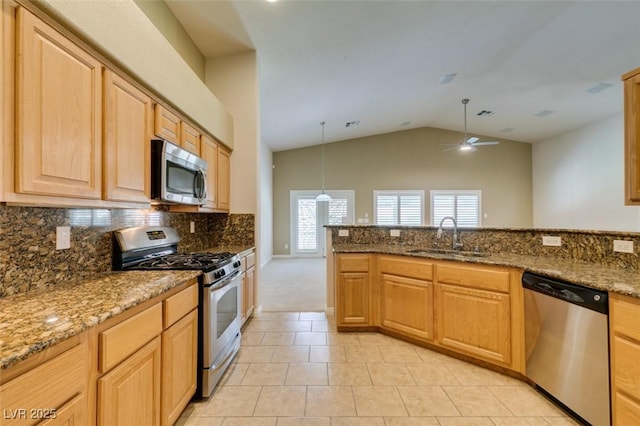 8204 Turbys Treehouse Pl, Las Vegas, NV 89131 - kitchen featuring appliances with stainless steel finishes, lofted ceiling, ceiling fan, tasteful backsplash, and light tile patterned flooring
