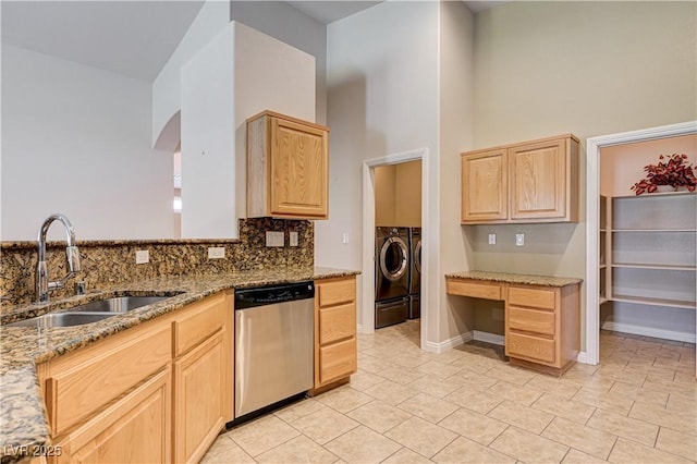 8204 Turbys Treehouse Pl, Las Vegas, NV 89131 - kitchen featuring dishwasher, light brown cabinets, independent washer and dryer, tasteful backsplash, and a high ceiling