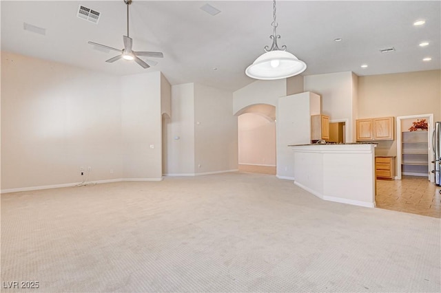 8204 Turbys Treehouse Pl, Las Vegas, NV 89131 - unfurnished living room with arched walkways, light colored carpet, a ceiling fan, recessed lighting, and vaulted ceiling