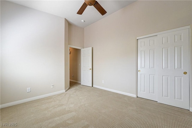 8204 Turbys Treehouse Pl, Las Vegas, NV 89131 - unfurnished bedroom featuring light colored carpet, a closet, high vaulted ceiling, and ceiling fan