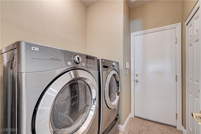 8204 Turbys Treehouse Pl, Las Vegas, NV 89131 - laundry area with washing machine and dryer and baseboards
