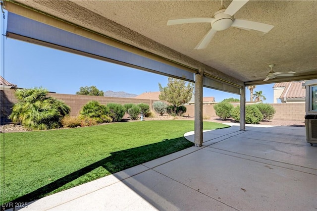 8204 Turbys Treehouse Pl, Las Vegas, NV 89131 - fenced backyard featuring ceiling fan and a patio area