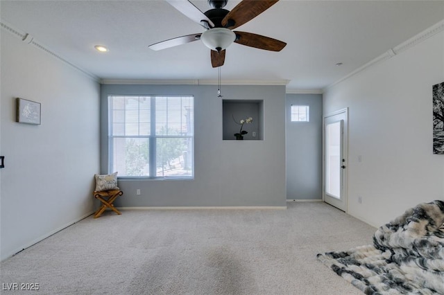 5855 Valley Dr Unit 2092, North Las Vegas, NV 89031 - unfurnished living room with ornamental molding, ceiling fan, and carpet