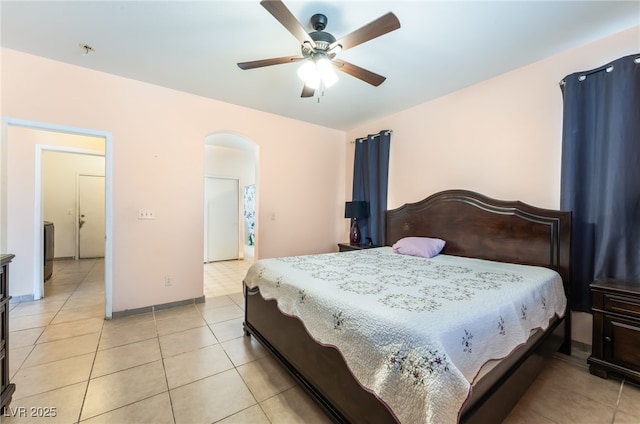 3108 Sentimental Ct, North Las Vegas, NV 89031 - bedroom featuring arched walkways, light tile patterned floors, and ceiling fan