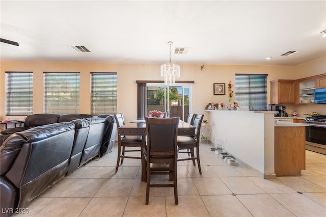 3108 Sentimental Ct, North Las Vegas, NV 89031 - dining area with a chandelier, light tile patterned floors, and recessed lighting