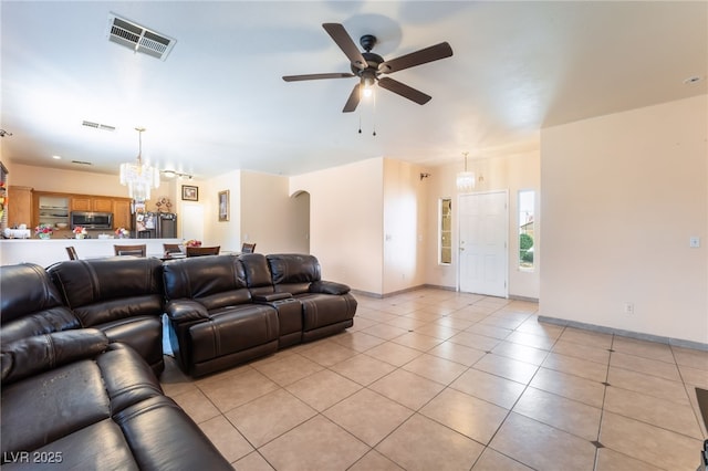 3108 Sentimental Ct, North Las Vegas, NV 89031 - living area featuring a ceiling fan, a chandelier, light tile patterned floors, and arched walkways