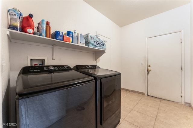 3108 Sentimental Ct, North Las Vegas, NV 89031 - laundry area with washing machine and dryer and light tile patterned floors