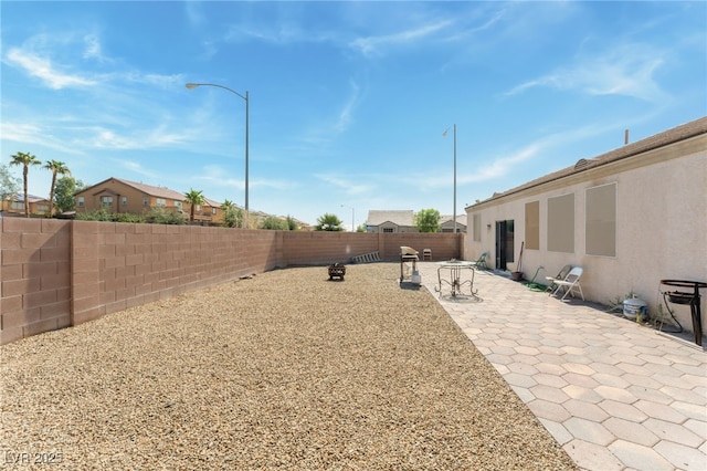 3108 Sentimental Ct, North Las Vegas, NV 89031 - fenced backyard with a patio area