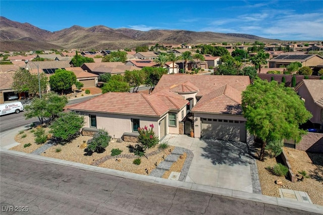 2333 Indigo Island St, Henderson, NV 89044 - view of front facade with a residential view, stucco siding, a garage, and concrete driveway