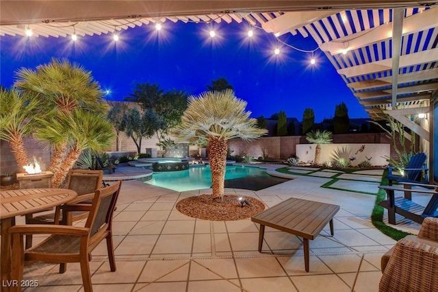 2333 Indigo Island St, Henderson, NV 89044 - pool at twilight with a patio, a fenced backyard, a pool with connected hot tub, and a pergola