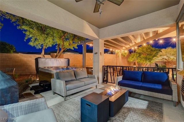 2333 Indigo Island St, Henderson, NV 89044 - patio at twilight with an outdoor living space with a fire pit, a fenced backyard, ceiling fan, and a patio