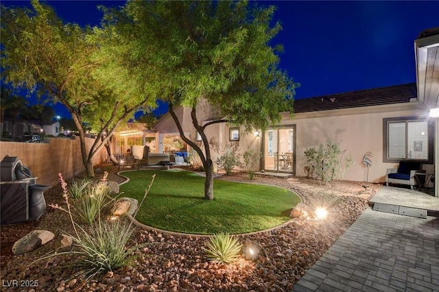 2333 Indigo Island St, Henderson, NV 89044 - yard at twilight featuring a patio area