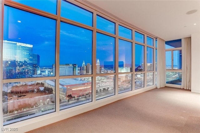 4575 Dean Martin Dr Unit 2607, Las Vegas, NV 89103 - unfurnished sunroom featuring carpet flooring and a view of city lights