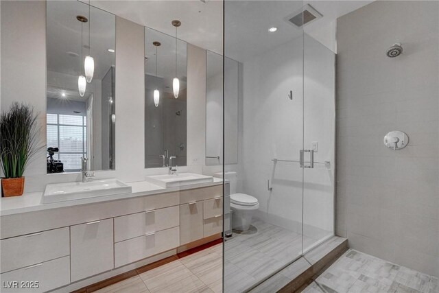 4575 Dean Martin Dr Unit 2607, Las Vegas, NV 89103 - bathroom featuring double vanity, a shower stall, and tile patterned floors