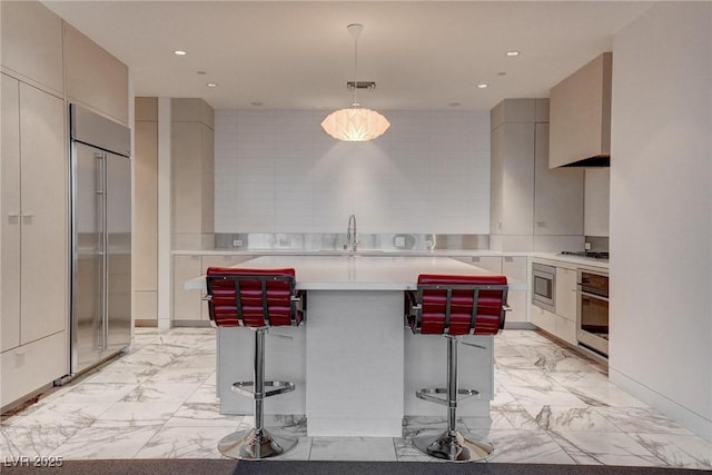 4575 Dean Martin Dr Unit 2607, Las Vegas, NV 89103 - kitchen with appliances with stainless steel finishes, light countertops, light marble finish flooring, a center island, and modern cabinets