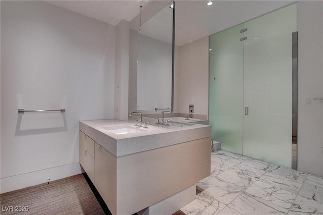 4575 Dean Martin Dr Unit 2607, Las Vegas, NV 89103 - bathroom featuring double vanity and a shower stall