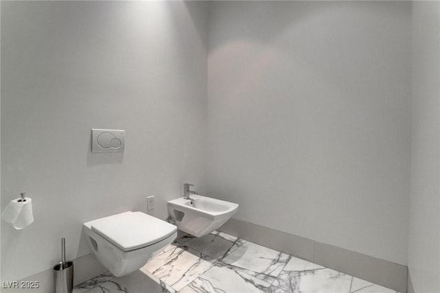 4575 Dean Martin Dr Unit 2607, Las Vegas, NV 89103 - bathroom with marble finish flooring and a bidet