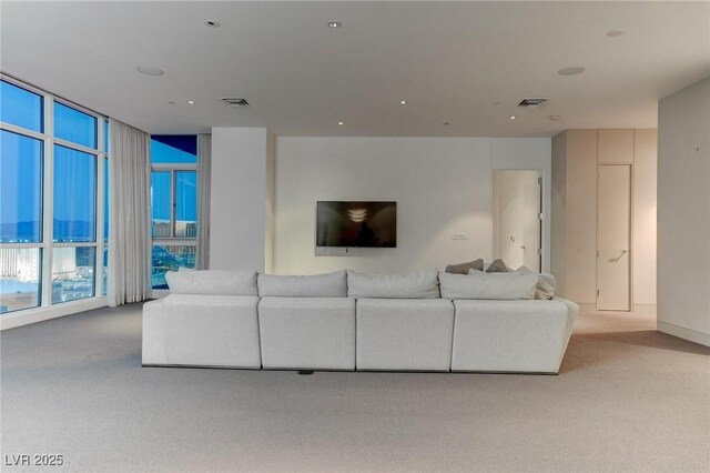 4575 Dean Martin Dr Unit 2607, Las Vegas, NV 89103 - carpeted living area featuring floor to ceiling windows