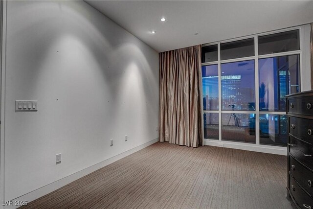 4575 Dean Martin Dr Unit 2607, Las Vegas, NV 89103 - unfurnished room with carpet, expansive windows, and recessed lighting