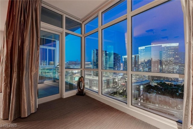 4575 Dean Martin Dr Unit 2607, Las Vegas, NV 89103 - unfurnished sunroom with carpet and a view of city lights