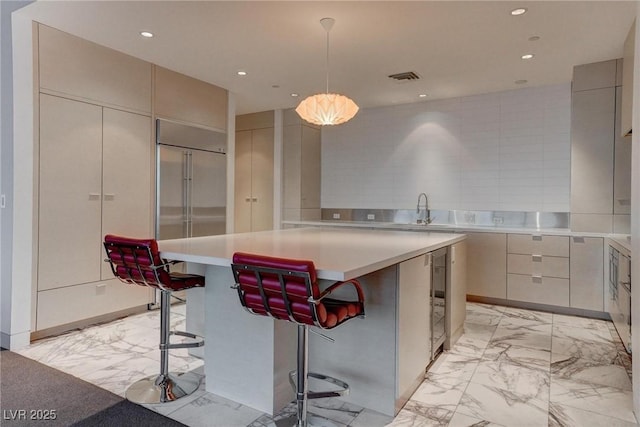 4575 Dean Martin Dr Unit 2607, Las Vegas, NV 89103 - kitchen featuring light marble finish floors, modern cabinets, light countertops, and recessed lighting