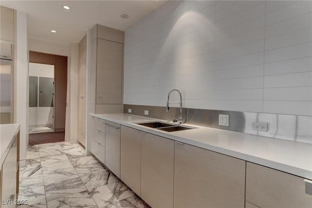 4575 Dean Martin Dr Unit 2607, Las Vegas, NV 89103 - kitchen featuring light marble finish floors, light countertops, recessed lighting, and decorative backsplash