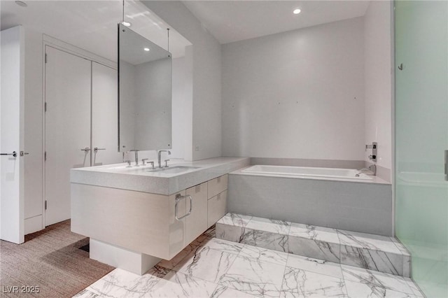 4575 Dean Martin Dr Unit 2607, Las Vegas, NV 89103 - full bath featuring a bath, double vanity, recessed lighting, and marble look tile flooring