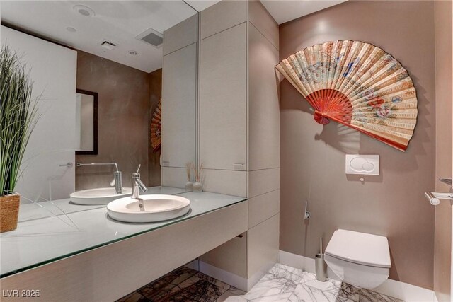 4575 Dean Martin Dr Unit 2607, Las Vegas, NV 89103 - half bath featuring marble finish flooring and vanity
