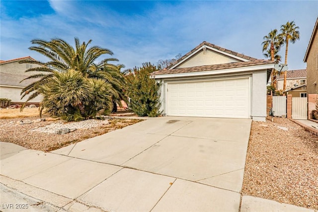 9514 Teton Vista Ave, Las Vegas, NV 89117 - view of front of home with concrete driveway and stucco siding