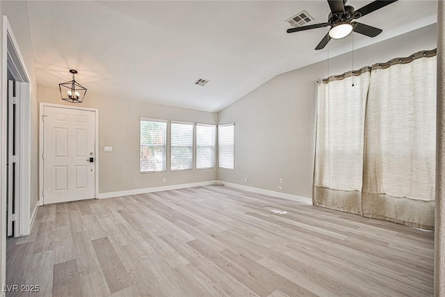 9514 Teton Vista Ave, Las Vegas, NV 89117 - unfurnished living room with lofted ceiling, a chandelier, light wood-type flooring, and ceiling fan