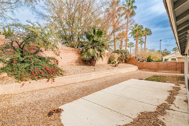 9514 Teton Vista Ave, Las Vegas, NV 89117 - fenced backyard featuring a patio