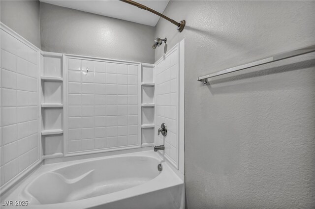 9104 Pearl Cotton Ave, Las Vegas, NV 89149 - bathroom featuring a textured wall and shower / bath combination