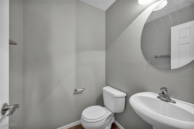 9104 Pearl Cotton Ave, Las Vegas, NV 89149 - half bath featuring a sink and toilet