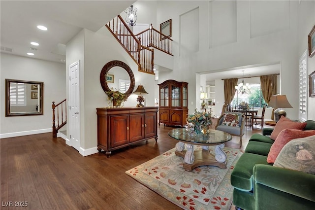 326 Caneflower Ct, North Las Vegas, NV 89031 - living room with a chandelier, stairs, dark wood-style floors, recessed lighting, and a towering ceiling