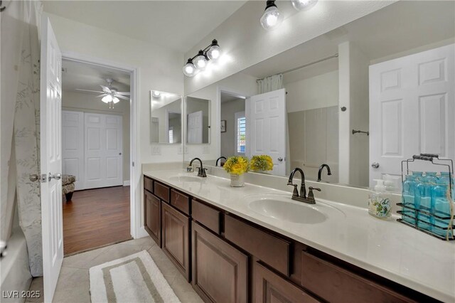326 Caneflower Ct, North Las Vegas, NV 89031 - full bath with double vanity, ceiling fan, and tile patterned flooring