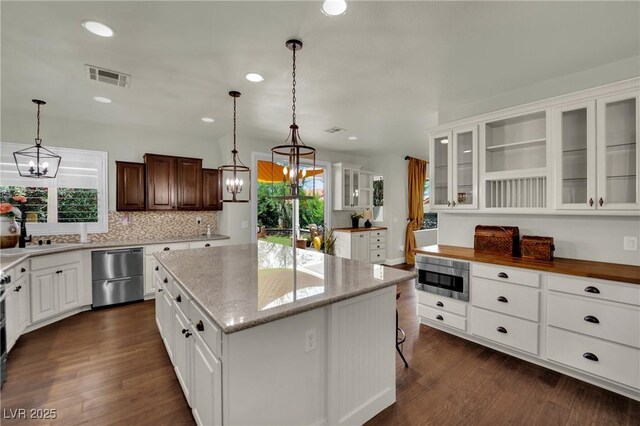 326 Caneflower Ct, North Las Vegas, NV 89031 - kitchen featuring stainless steel appliances, a chandelier, a center island, dark wood-style flooring, and recessed lighting