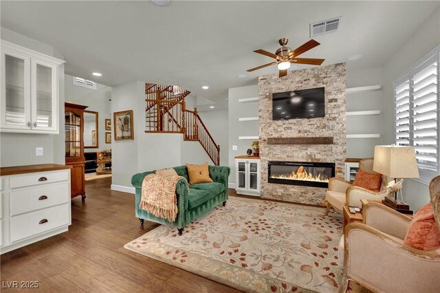 326 Caneflower Ct, North Las Vegas, NV 89031 - living room featuring a ceiling fan, wood finished floors, stairway, a fireplace, and recessed lighting