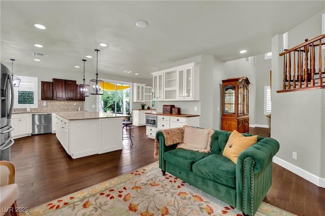 326 Caneflower Ct, North Las Vegas, NV 89031 - living room with dark wood-style flooring and recessed lighting