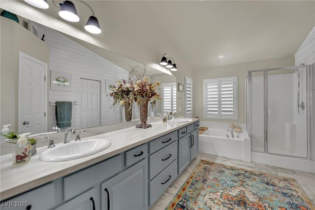 326 Caneflower Ct, North Las Vegas, NV 89031 - bathroom with double vanity, a garden tub, a shower stall, marble finish floors, and high vaulted ceiling