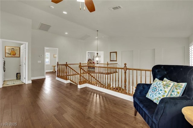 326 Caneflower Ct, North Las Vegas, NV 89031 - living area with an upstairs landing, lofted ceiling, wood finished floors, ceiling fan, and a chandelier