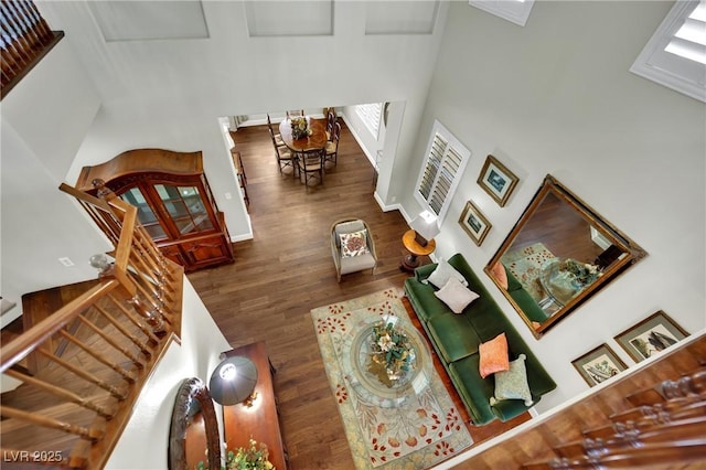 326 Caneflower Ct, North Las Vegas, NV 89031 - living area with a towering ceiling, wood finished floors, and stairs