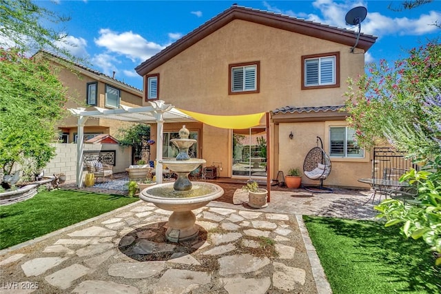 326 Caneflower Ct, North Las Vegas, NV 89031 - back of property featuring stucco siding, a pergola, a patio, and a tile roof