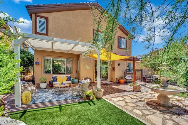 326 Caneflower Ct, North Las Vegas, NV 89031 - back of property featuring stucco siding, a patio, and an outdoor hangout area