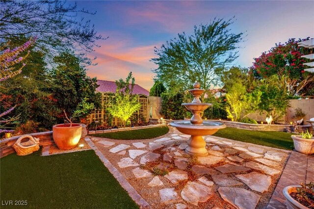 326 Caneflower Ct, North Las Vegas, NV 89031 - patio terrace at dusk with a fenced backyard and a patio