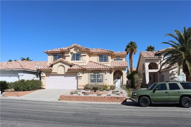 8982 Emerald Waters Ct, Las Vegas, NV 89147 - mediterranean / spanish house with stucco siding, concrete driveway, and a tile roof