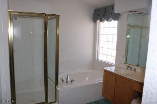 8982 Emerald Waters Ct, Las Vegas, NV 89147 - full bath with a stall shower, a garden tub, and vanity
