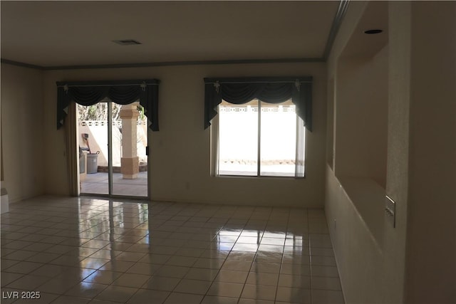 8982 Emerald Waters Ct, Las Vegas, NV 89147 - spare room featuring light tile patterned flooring and ornamental molding