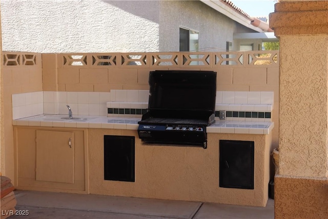 8982 Emerald Waters Ct, Las Vegas, NV 89147 - view of patio featuring exterior kitchen and a sink