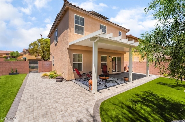 9373 Wild Lariat Ave, Las Vegas, NV 89178 - rear view of property with a gate, stucco siding, and a patio