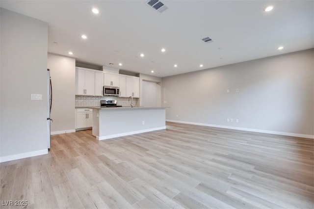 11922 Glide Reflection Ave, Las Vegas, NV 89138 - unfurnished living room featuring recessed lighting and light wood-style floors